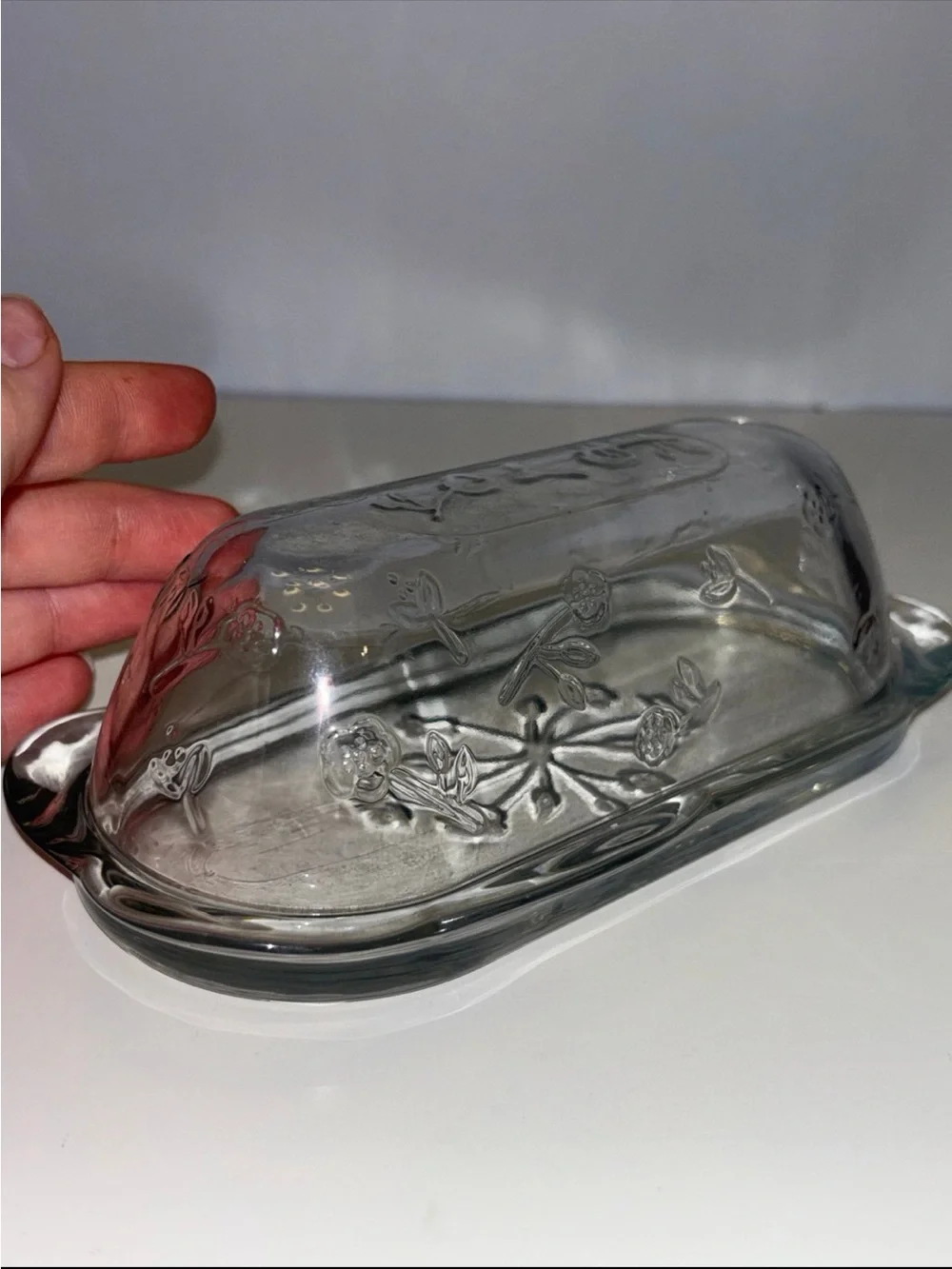 Anchor Hocking Savannah butter dish features a pressed clear glass design flower